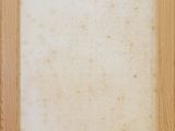 an old photo of a wooden frame with a white background