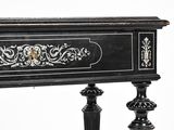 a black table with a gold decoration on top of it