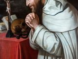 painting of a man in a white robe with a cat on a table