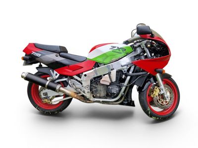 a red and green motorcycle parked on a white surface