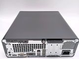 the back view of a computer with a hard drive on top of it