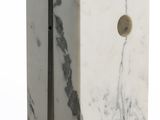 a white marble block with a hole in the middle of it
