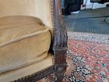 a chair that is sitting on a rug on the floor
