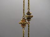gold plated necklace with a teapot and a teapot hanging from it ' s chain