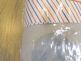 a close up of a plastic bag on a wooden table