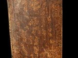 a close up of a brown book on a black background