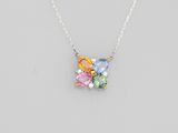 a close up of a necklace with multi colored stones on a chain