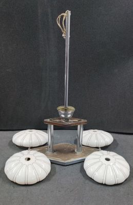 five white vases sitting on top of a table