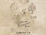 a close up of a piece of wood with stamps on it