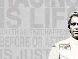 a man standing in front of a wall with a quote on it