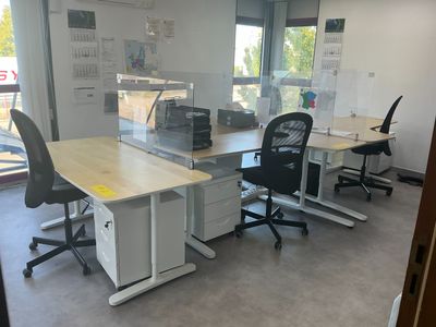 an image of an office with two desks and two chairs