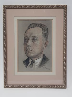 portrait of a man in a suit and tie in a frame