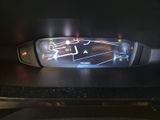 a close up of a car ' s dashboard with a digital display