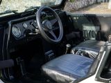 a black and white jeep with a steering wheel and dashboard