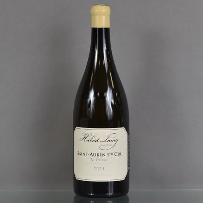 a bottle of wine sitting on a glass table