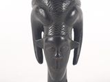an image of a black vase with horns on it