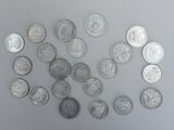 a lot of coins that are on the table