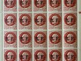 a close up of a sheet of red and white postage stamps