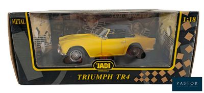 the box is open to show a yellow toy car in it ' s packaging