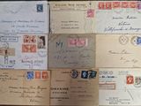 many different types of letters and envelopes on the table