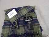 a blanket with a tag on it on a table
