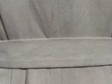 a close up of a dress with a belt on a mannequin mannequin mannequin mannequin mannequin mannequin mannequin