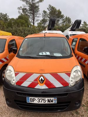 many orange and white vans parked in a parking lot
