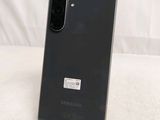a close up of the back of a black samsung galaxy s20