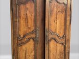 armoire ancienne en bois à deux portes et deux tiroirs