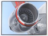 a picture of a jet engine on the side of a plane