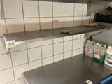 a stainless steel counter top in a commercial kitchen