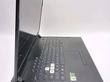 a laptop that is open on a white surface