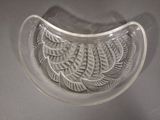 a clear glass bowl with a decorative design on it