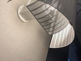 a lamp that is hanging on the wall in the room