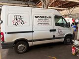 a white van that is parked inside of a building