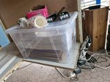 a plastic box with a lot of items in it