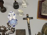 a lot of religious items on the table