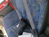 a seat in the back of a car with a bag on it