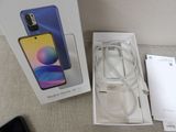 a box with a phone inside of it on a table