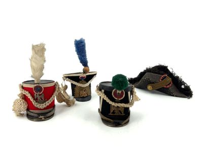 several different types of tin cans are lined up on a white surface