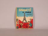 un vieux livre pour enfants avec une image de la Tour Eiffel en arrière-plan