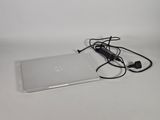 a laptop and ear buds sitting on a table