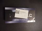 a card with a qr code on it on a table