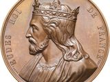 an image of a close up of a medal with a crown on it