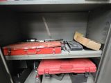 a metal cabinet with a bunch of tools on it