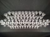 a close up of a bunch of empty wine glasses on a table