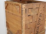 a wooden crate that has some writing on it