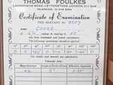 a sign on the wall that says thomas foukes