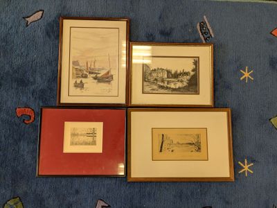 three framed pictures of boats on a blue rug on a blue floor