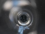 a blurry image of a clock in a glass of water